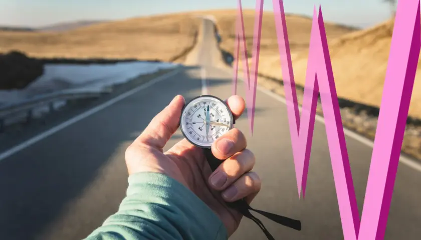 Kompass auf einer Straße, der die Richtung für die weltweite Marktkapitalisierung weist, mit einer pinken Linie, die einen Aufwärtstrend symbolisiert.
